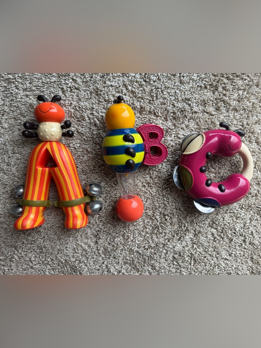 B. Toys ABC Musical Instrument Set Baby Toddler Rattles Tambourine Bells 3 Pc